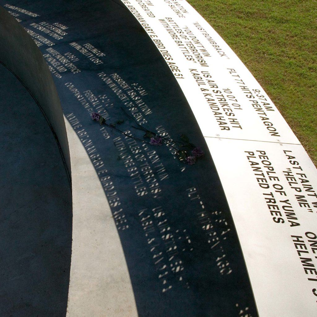 The circular canopy of the memorial weaves together two timelines of phrases—one representing the events on the day and the other representing the developments that followed