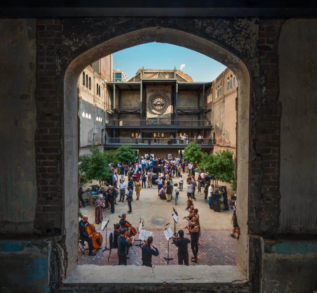 passageway frames courtyard with band playing