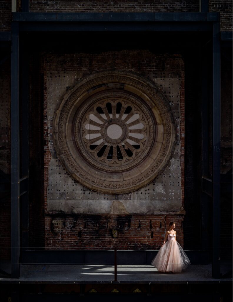 ballerina in front of rose window