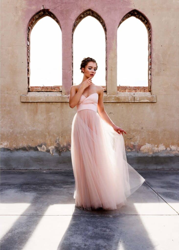 ballerina in front of windows