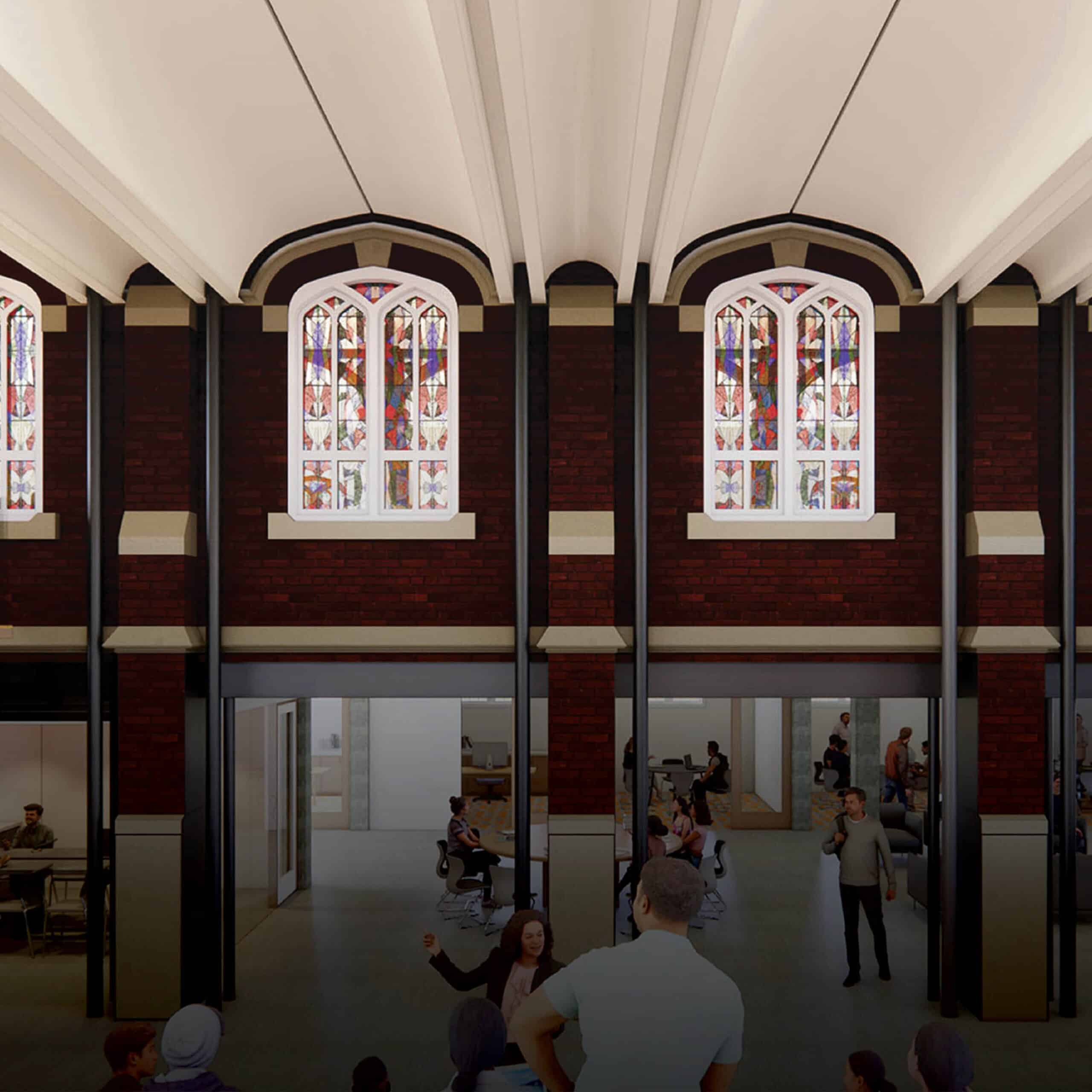 connection of previously exterior brick wall including stained glass windows on upper level, lower level with round tables and office space