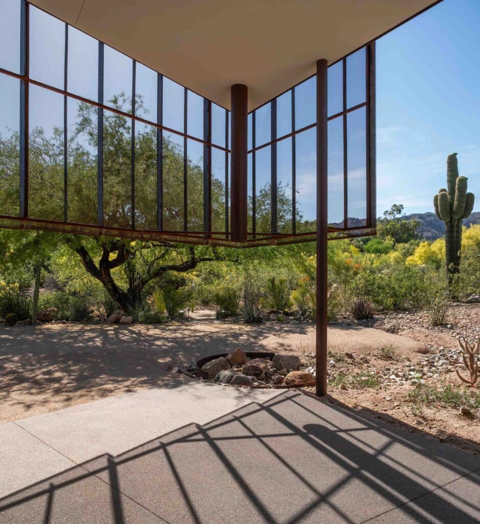 steel pipe channels all roof runoff into a native rain garden