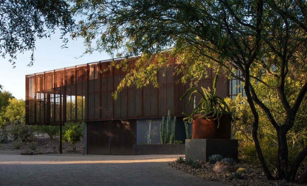 Camelback Casita structure emerging from behind palo verde trees