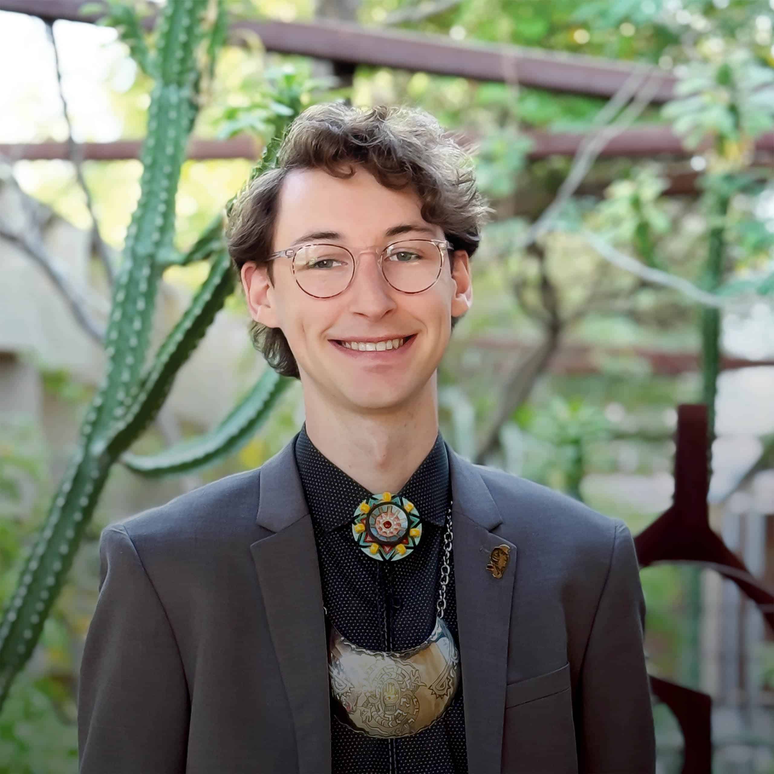 Zane Wyatt, AIA, NCARB standing in garden at Jones Studio office building